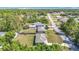 An aerial view showcases the neighborhood's layout and a blend of residential properties and green spaces at 15640 Sw 48 Ave, Ocala, FL 34473