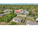 Aerial view showcasing a well-maintained home with a fenced backyard and lush surrounding greenery at 15640 Sw 48 Ave, Ocala, FL 34473