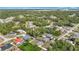 An aerial view of a neighborhood surrounded by lush greenery and tree-lined streets at 15640 Sw 48 Ave, Ocala, FL 34473