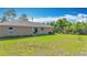 Spacious backyard featuring well-maintained lawn and a view of the surrounding trees at 15640 Sw 48 Ave, Ocala, FL 34473