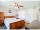 This bedroom features a ceiling fan, carpet flooring, and a spacious closet at 15640 Sw 48 Ave, Ocala, FL 34473