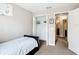 Neutral bedroom includes a closet, carpet, and doorway to a bathroom at 15640 Sw 48 Ave, Ocala, FL 34473