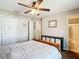 Bedroom featuring a wooden bed frame, closet, and entry to a bathroom at 15640 Sw 48 Ave, Ocala, FL 34473