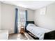 Cozy bedroom with natural light, blue curtains, and decor at 15640 Sw 48 Ave, Ocala, FL 34473