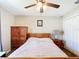 This bedroom features a ceiling fan, carpet flooring, and a spacious closet at 15640 Sw 48 Ave, Ocala, FL 34473