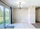 Bright breakfast nook with sliding glass doors leading to the backyard and an elegant chandelier at 15640 Sw 48 Ave, Ocala, FL 34473