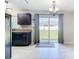 Eat-in kitchen featuring black appliances, tile flooring, and sliding glass doors to the backyard at 15640 Sw 48 Ave, Ocala, FL 34473