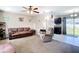 Cozy living room featuring neutral paint, plush carpet flooring, and access to the kitchen at 15640 Sw 48 Ave, Ocala, FL 34473