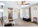Cozy living room featuring neutral paint, plush carpet flooring, a ceiling fan, and natural light at 15640 Sw 48 Ave, Ocala, FL 34473