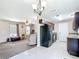Open concept living area with kitchen view and breakfast nook, featuring neutral paint and black appliances at 15640 Sw 48 Ave, Ocala, FL 34473