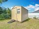 Backyard storage shed featuring a rolling ramp, a single window and aluminum siding at 15640 Sw 48 Ave, Ocala, FL 34473