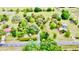 Expansive lot with mature trees, a long drive, and multiple structures on the property at 16850 Se 19Th Ct, Summerfield, FL 34491