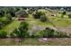 Spacious lot with lush landscaping, mature trees, and outbuildings perfect for a private retreat at 16850 Se 19Th Ct, Summerfield, FL 34491