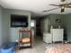 Spacious bedroom with neutral paint, ceiling fan, and tile floor at 16850 Se 19Th Ct, Summerfield, FL 34491
