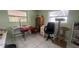 Versatile bonus room with tile flooring, multiple windows, and ample space at 16850 Se 19Th Ct, Summerfield, FL 34491
