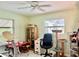 Versatile bonus room with tile flooring, multiple windows, a ceiling fan, and ample space at 16850 Se 19Th Ct, Summerfield, FL 34491