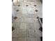 Close-up view of the tile flooring with diamond-patterned accents at 16850 Se 19Th Ct, Summerfield, FL 34491