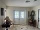 Inviting foyer featuring tile floors and double front doors with decorative glass panels at 16850 Se 19Th Ct, Summerfield, FL 34491