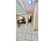 Long hallway with tile floors providing access and view to other rooms at 16850 Se 19Th Ct, Summerfield, FL 34491