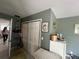 Hallway featuring sliding door closet, with neutral paint, and tile flooring at 16850 Se 19Th Ct, Summerfield, FL 34491
