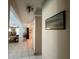 Hallway featuring neutral wall paint and tile flooring that connects to other rooms in the home at 16850 Se 19Th Ct, Summerfield, FL 34491