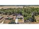 Expansive aerial view of a single-Gathering home with green surroundings and a view of distant fields at 171 Oak Cir, Ocala, FL 34472