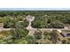 Neighborhood aerial view showcasing the homes and lush surrounding trees at 171 Oak Cir, Ocala, FL 34472