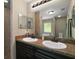 Bathroom featuring double vanity and granite countertops at 171 Oak Cir, Ocala, FL 34472