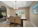 Cozy dining room with stylish furnishings, recessed lighting, and a large window for natural light at 171 Oak Cir, Ocala, FL 34472