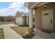 A welcoming home exterior with a charming front porch, pillars, and a well-maintained lawn and driveway at 171 Oak Cir, Ocala, FL 34472
