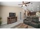 Open concept living room with entertainment center and vaulted ceiling at 171 Oak Cir, Ocala, FL 34472