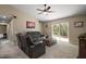 Bright living room with comfy furniture and a ceiling fan at 171 Oak Cir, Ocala, FL 34472