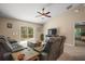 Living room offers natural light, vaulted ceiling, and ceiling fan at 171 Oak Cir, Ocala, FL 34472