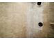 Shower features neutral tile with black showerhead and fixtures, offering a modern and stylish design at 171 Oak Cir, Ocala, FL 34472