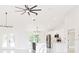 Open-concept living space with modern light fixtures and vaulted ceilings at 174 Sequioa Trl, Ocklawaha, FL 32179