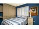 Inviting bedroom showcases a comfortable bed, bright window, and ample closet space at 20820 River Dr # B25, Dunnellon, FL 34431