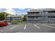 View of the exterior of the community with assigned parking and balconies for each unit at 20820 River Dr # B25, Dunnellon, FL 34431