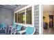 Inviting front porch with comfortable seating, offering a glimpse inside the home at 20820 River Dr # B25, Dunnellon, FL 34431