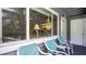 Charming front porch with seating, offering a sneak peek inside with plenty of natural light at 20820 River Dr # B25, Dunnellon, FL 34431