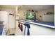 Kitchen bar with blue tile countertop, nautical decorations, and pendant lighting at 20820 River Dr # B25, Dunnellon, FL 34431