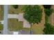 A birds-eye view of the home and it's roof, surrounded by trees at 21425 Sw Plantation St, Dunnellon, FL 34431