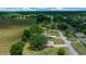 Aerial view of a community near an agricultural field, showcasing the neighborhood's serene location at 21425 Sw Plantation St, Dunnellon, FL 34431