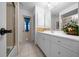 Well-lit bathroom featuring a modern vanity, updated fixtures, and tiled flooring at 21425 Sw Plantation St, Dunnellon, FL 34431