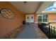 Inviting entryway featuring double doors, decorative accents, and manicured landscaping at 21425 Sw Plantation St, Dunnellon, FL 34431