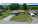 Charming single-story home featuring a well-maintained lawn, attached garage, and a long driveway at 21425 Sw Plantation St, Dunnellon, FL 34431