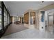 Bright Florida room with tile flooring and large windows providing lots of sunlight at 21425 Sw Plantation St, Dunnellon, FL 34431