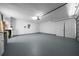 Large garage space with finished floor, multiple doors, and plenty of room for vehicles at 21425 Sw Plantation St, Dunnellon, FL 34431