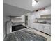 Bright kitchen features stainless steel appliances, granite countertops, and a sleek cooktop at 21425 Sw Plantation St, Dunnellon, FL 34431