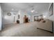 Spacious living room with neutral carpet and lots of natural light at 21425 Sw Plantation St, Dunnellon, FL 34431