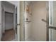 Shower featuring tile surround, glass door, and built in shelving at 21425 Sw Plantation St, Dunnellon, FL 34431